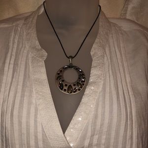 Opal white V-neck blouse with different necklaces
